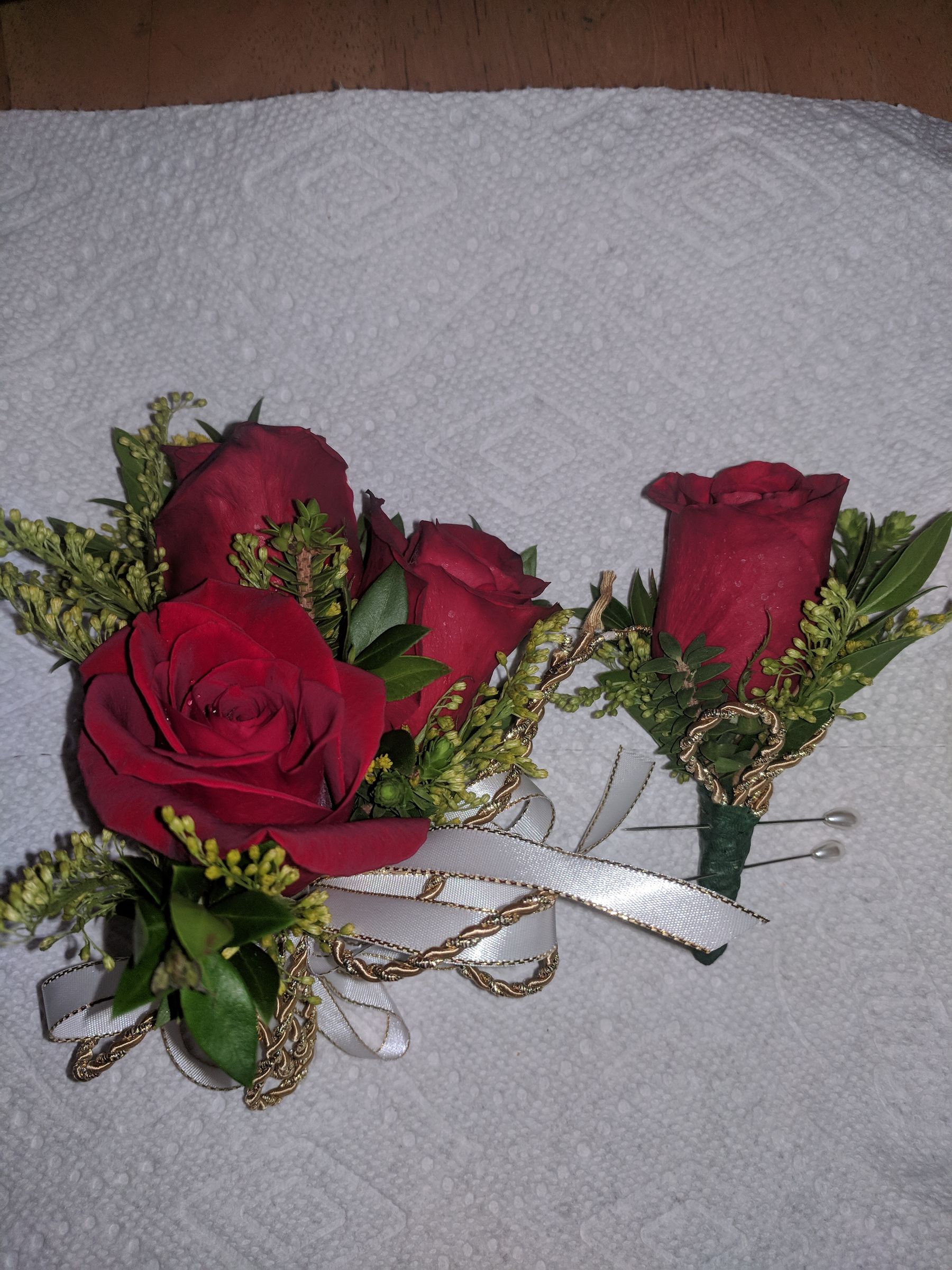 Red rose boutonniere and corsage