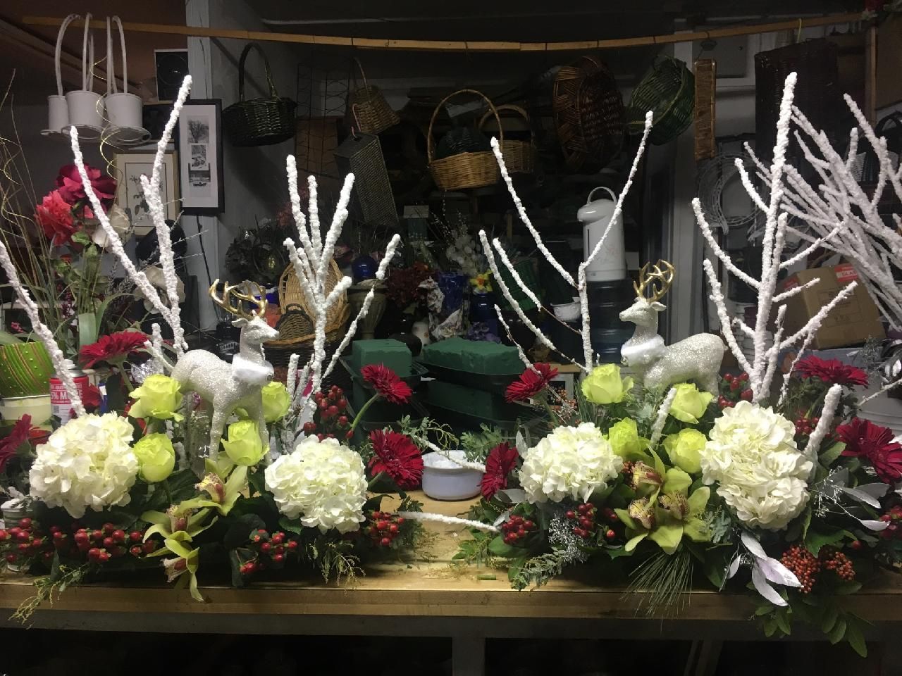 Winter centerpieces with white branches and white hydrangeas